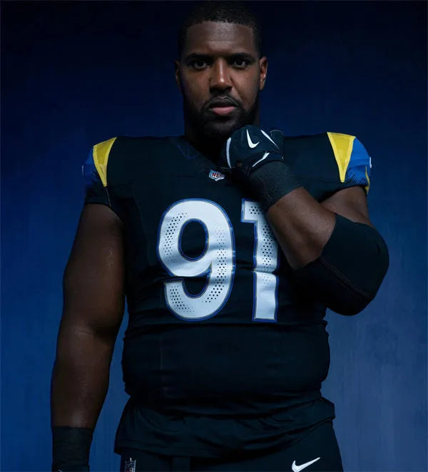 Mens Los Angeles Rams #91 Kobie Turner Midnight Blue 2025 Rivalries Collection Limited Jersey